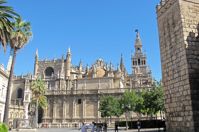 Alcazar and Cathedral of Seville Tour with Skip the Line Tickets - Seville Cathedral: Gothic scale and layered faith