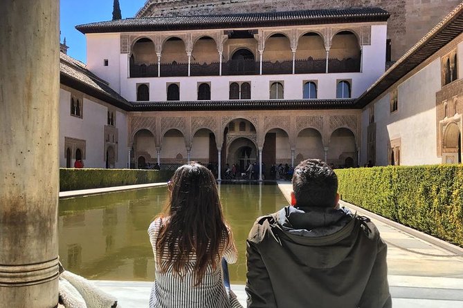 Alhambra &Charles Palace Guided Tour with Optional Nasrid Palaces - Entering the Alhambra and passing the long lines
