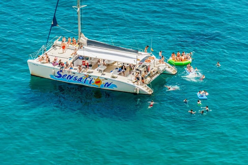 Barcelona: Catamaran Party Cruise with BBQ Meal - The Mediterranean swim stop