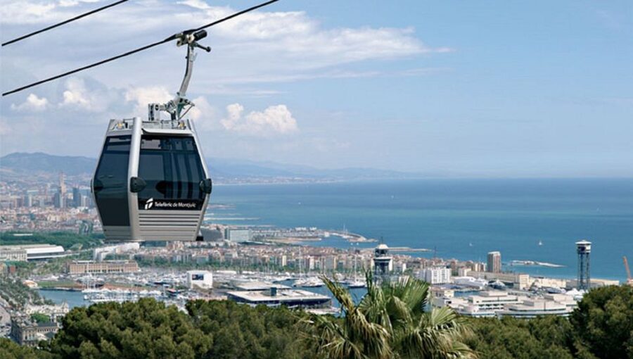 Barcelona: Montjuïc Cable Car Ticket with Audio Guide - The Barcelona walking tour: market, church, and city stories
