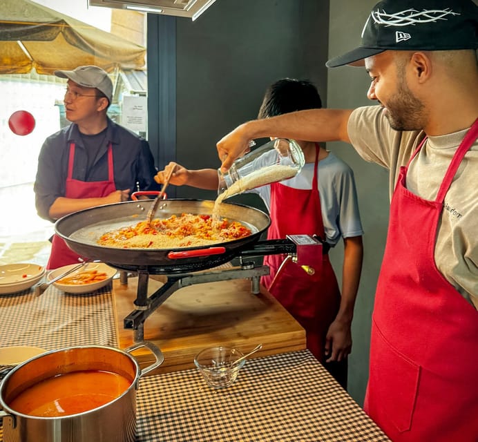 Barcelona: Seafood Paella ★Maestro★ & Tapas & Sangria - Choosing ingredients before the cooking starts