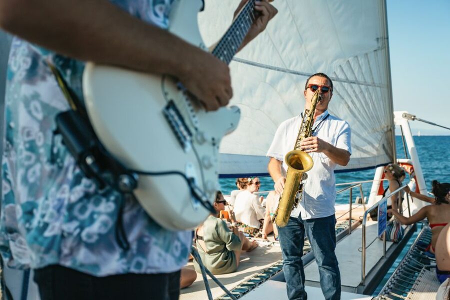 Barcelona: Sunset Catamaran Cruise with Live Music - Boarding the Catamaran Along Barcelona’s Coast