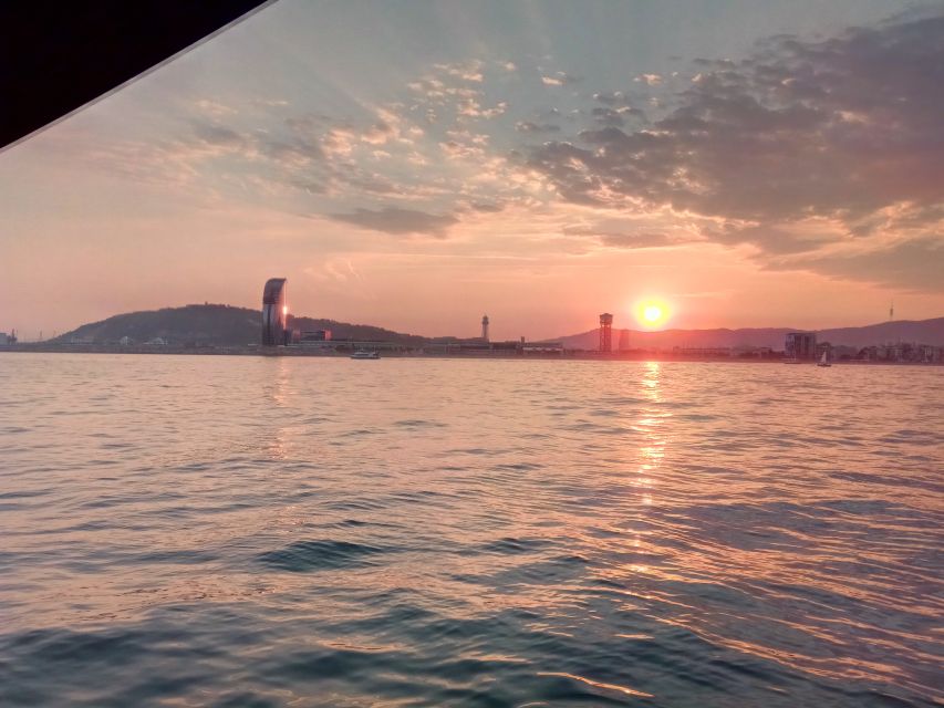 Barcelona: Sunset Sailing Tour with Open Bar & Snacks - Leaving the Olympic Port beneath the twin towers