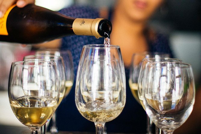 Barcelona With Locals: Wine and Tapas Private Tour - Three stops, three drinks, and the food you might taste