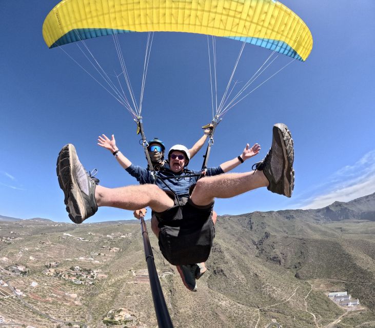 Costa Adeje: Tandem Paragliding Flight with Pickup - Mountain and coastline views from the air
