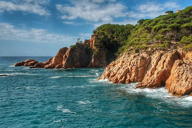 Costa Brava Tour with Kayak & Lagoon Snorkeling - Kayaking beneath the Costa Brava cliffs