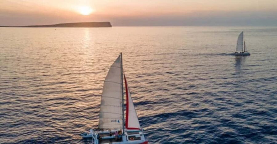Fornells: Catamaran Sunset Cruise of Menorca's Coast - Leaving Fornells as the evening cools