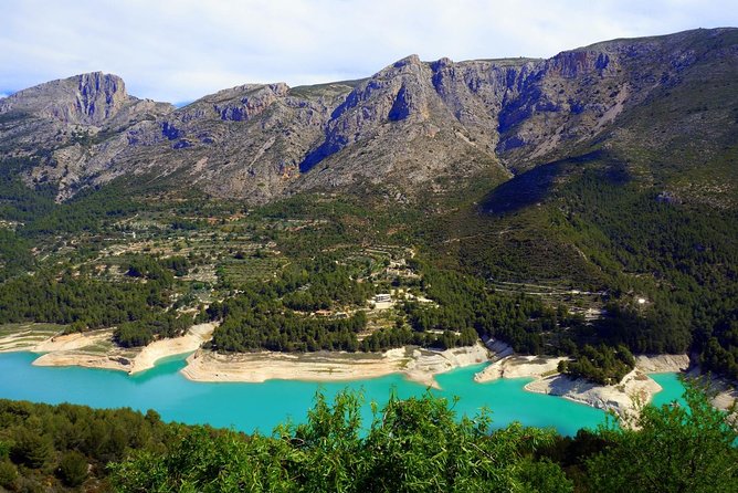 From Albir & Benidorm: Guadalest Village Excursion - The coach ride, pickups, and timing