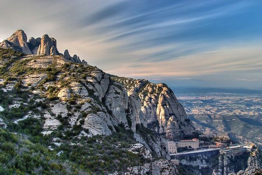 From Barcelona: Montserrat Tour, Rack Railway & Licor Taste - The guided visit: basilica, atrium, and sacristy