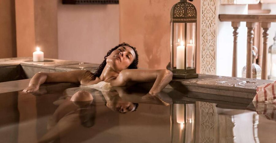 From Malaga: Hammam Bath, Kessa and Relaxing Massage Tour - The heated stone table and kessa scrub
