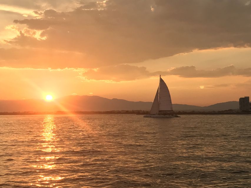 From Roses: Sunset Catamaran Cruise - Watching Roses and Empuriabrava change from the water