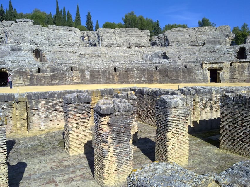 From Seville: Half-Day Guided Bike Trip to Italica - Entering the Roman city of Itálica