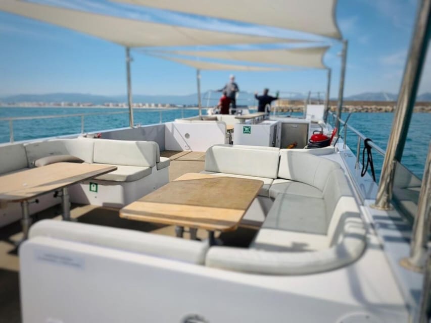 Gandía: Sea Cruise from Gandia with Sunset Option - Settling into the catamaran with a drink