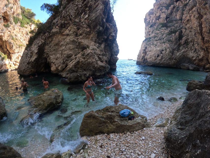 Granadella: Caló, Cova Llop Marí, and Ambolo Kayak Trip - Guides, languages, and the feel of the outing