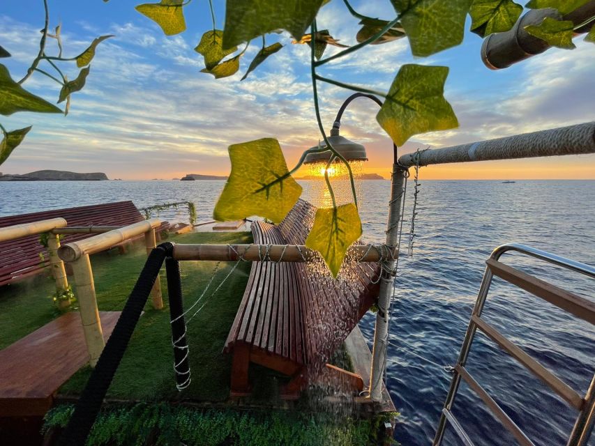 Ibiza: Sea Caves & Coves Snorkeling Paddle Boarding Tour - Drinks, fruit, music, and deck time
