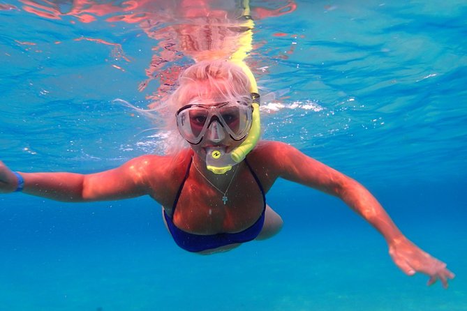 Ibiza Snorkeling Beach and Cave Tour - Snorkeling, paddleboarding, and jumping from the boat