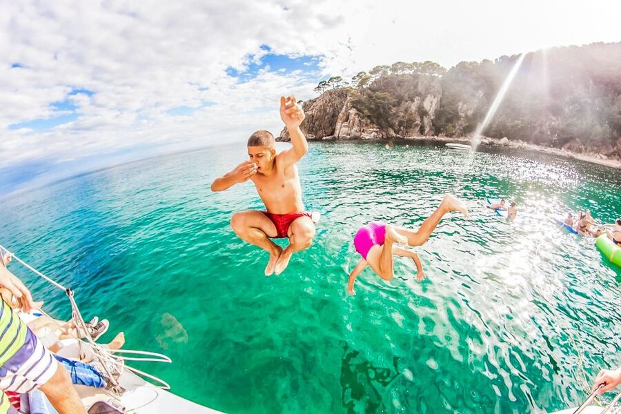 Lloret de Mar: Catamaran Sailing Cruise with BBQ and Drinks - Music, DJs, and the return to Lloret