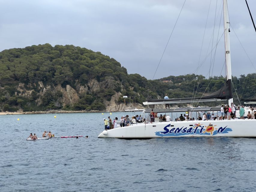 Lloret de Mar: Sunset Catamaran Cruise with DJ and Drinks - The quiet inlet and swimming stop