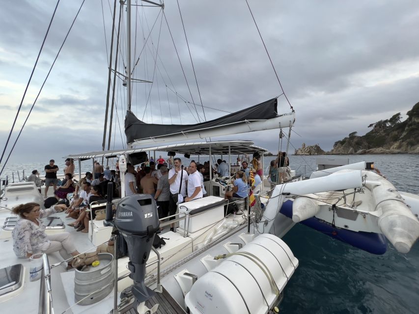 Lloret de Mar: Sunset Catamaran Cruise with DJ and Drinks - Sunset from the water