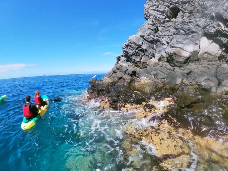 Los Cristianos: Kayak and Snorkel with Turtles and Photos - Entering a small sea cave