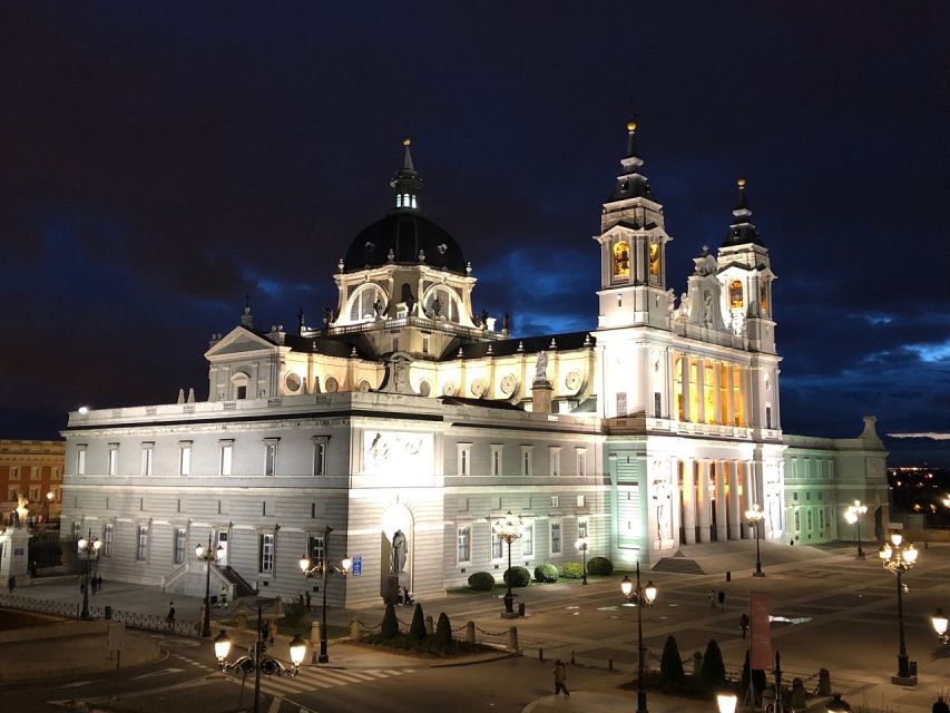 Madrid: Enchanted Evening Walking Tour in Spanish - Almudena Cathedral and Madrid’s supernatural side