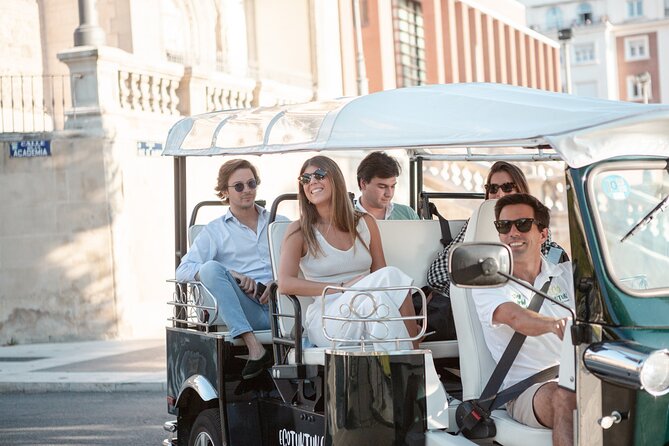 Madrid Express Tour with Local Guide in Eco Tuk Tuk Private - The Spanish Congress and its neoclassical lions