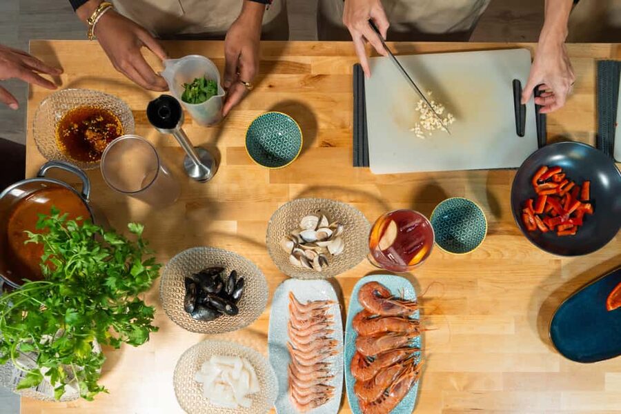 Madrid: Paella and Sangria Workshop with Tapas - Preparing paella with a professional chef
