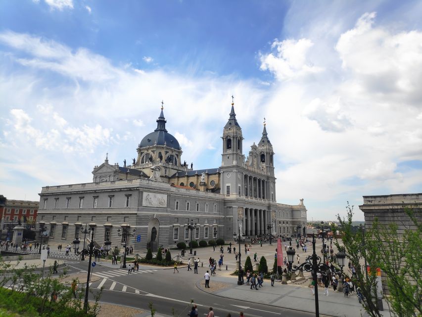 Madrid: Royal Palace and Almudena Cathedral Small-Group Tour - La Almudena Cathedral and its mix of styles