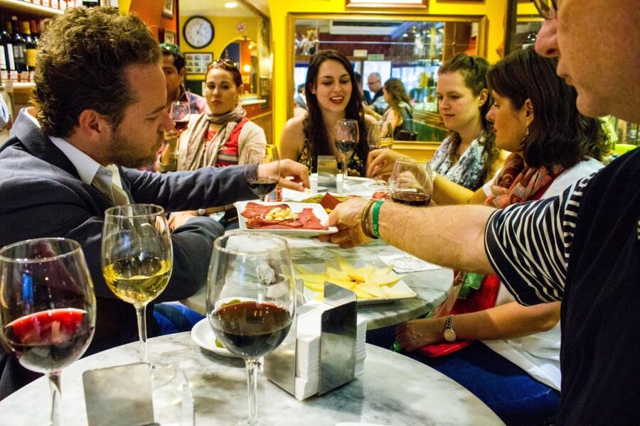 Madrid: Tapas & Wine Tasting Tour with Local Guide - Four old bars, 12 tapas, and a walk through old Madrid