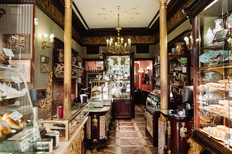 Madrid: Ultimate Food Tour of Local Markets & Tapas - Casa González, cheese, wine, and a political backstory
