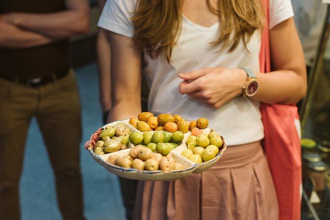 Madrid Ultimate Spanish Cuisine Food Tour - Casa González, cheese, wine, and a political past