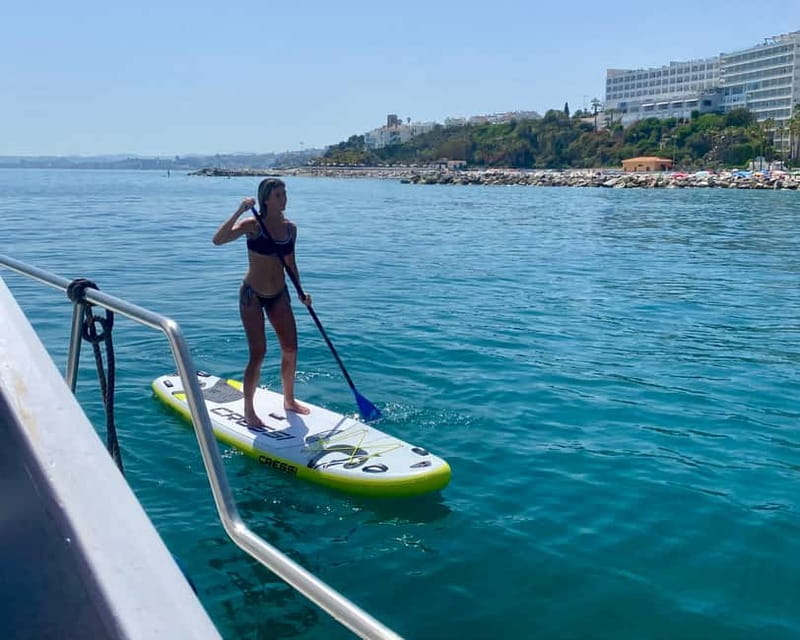 Málaga: Boat Tour w/ Snorkeling, Water Activities, and Lunch - A small boat along the Benalmádena coast