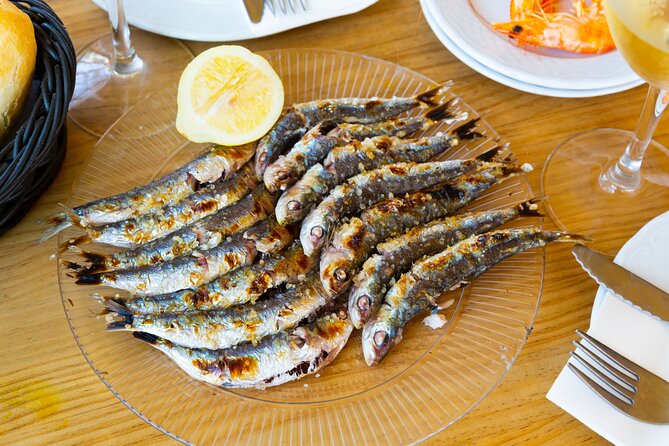 Malaga Food Tour: Tapas, Drinks and Delights with a Local - Stop one: a 1840 tavern and a small sweet-wine pairing