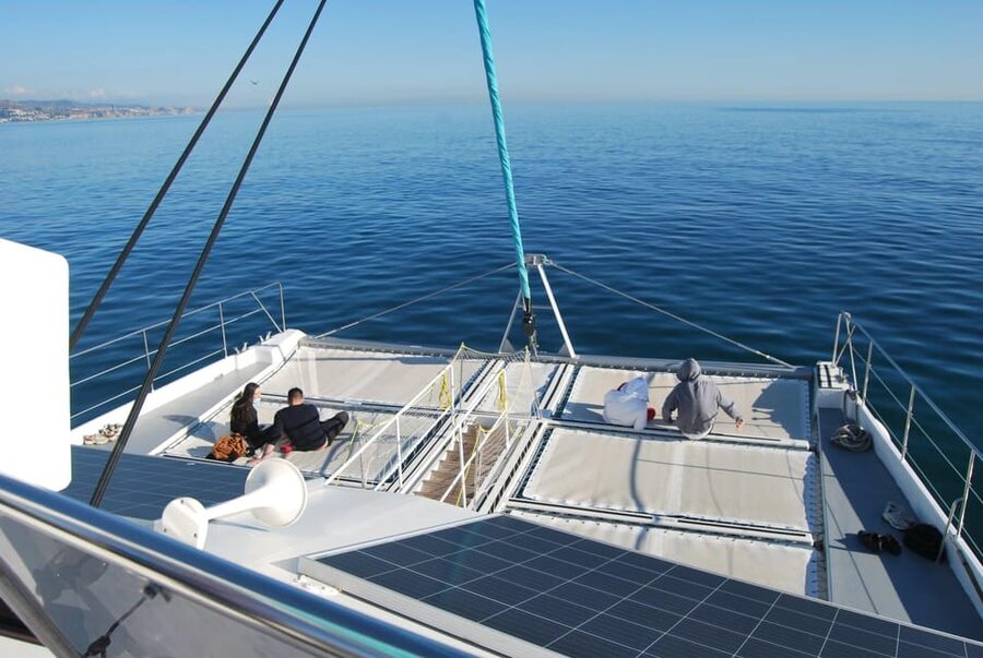 Malaga: Sailing Catamaran Sunset Cruise with Live DJ & Drink - Watching Málaga light up after sunset