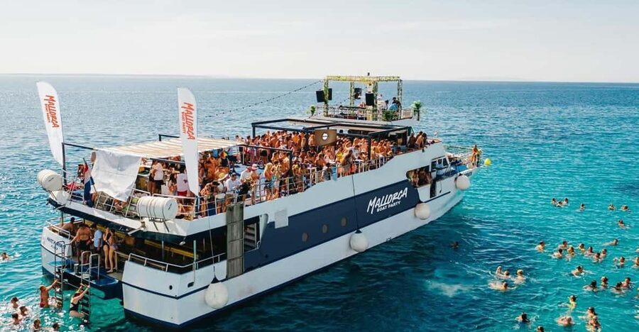 Mallorca: Boat Party with Live DJs, Lunch, & Nightclub Entry - The Palma coastline from the water