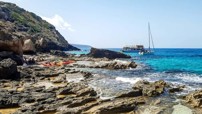 Mallorca: Sea Cave Kayaking Tour with Snorkeling and a Snack - Swimming and snorkeling in clear water