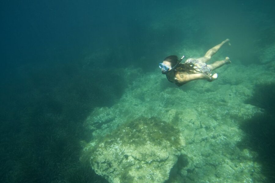 Menorca: Kayak and Marine Reserve Snorkeling Adventure - Paddling beside La Mola de Fornells