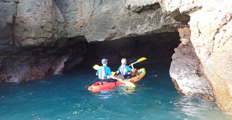 Mogán: Guided Kayak to Caves and Snorkeling Tour - Paddling beneath the white cliffs