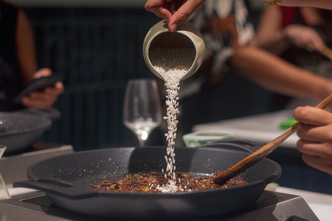 Paella Cooking Class in Madrid with Bottomless Wine Pairing - Eating Madrid classics around the communal table
