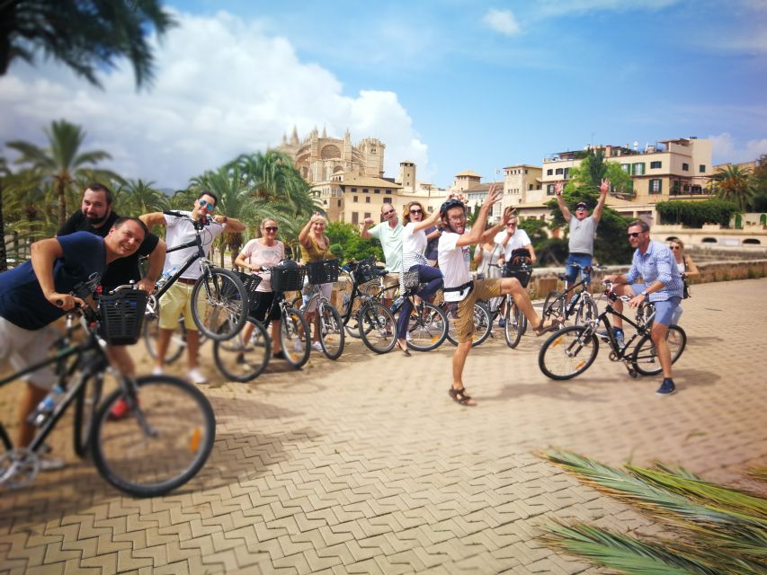Palma de Mallorca: Guided Bicycle Tour - Riding the seafront toward La Seu