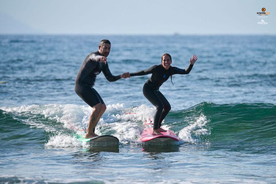 Playa de las Américas: Private or Small-Group Surf Lesson - Entering the water and catching your first wave