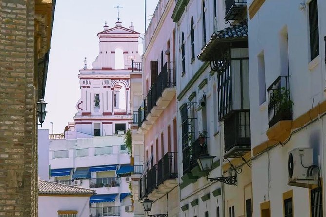 Sevilla Food Tour: Tapas, Wine, History & Traditions - Chicharrones, montaditos, and beer from the barrel