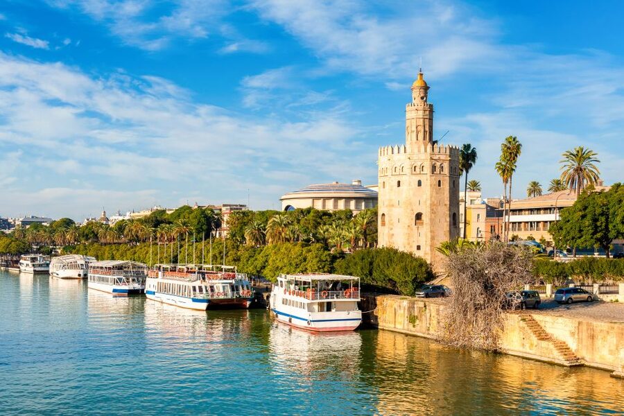 Seville: Authentic and Romantic Horse-Drawn Carriage Ride - Along the Guadalquivir riverside