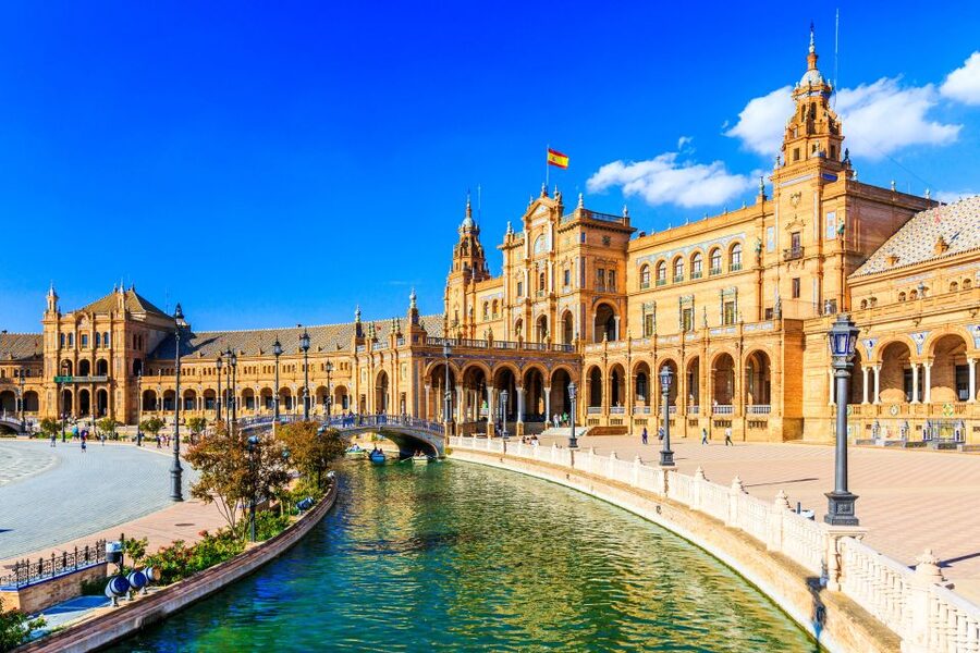Seville: Authentic and Romantic Horse-Drawn Carriage Ride - The Hotel Alfonso XIII and grand Seville views