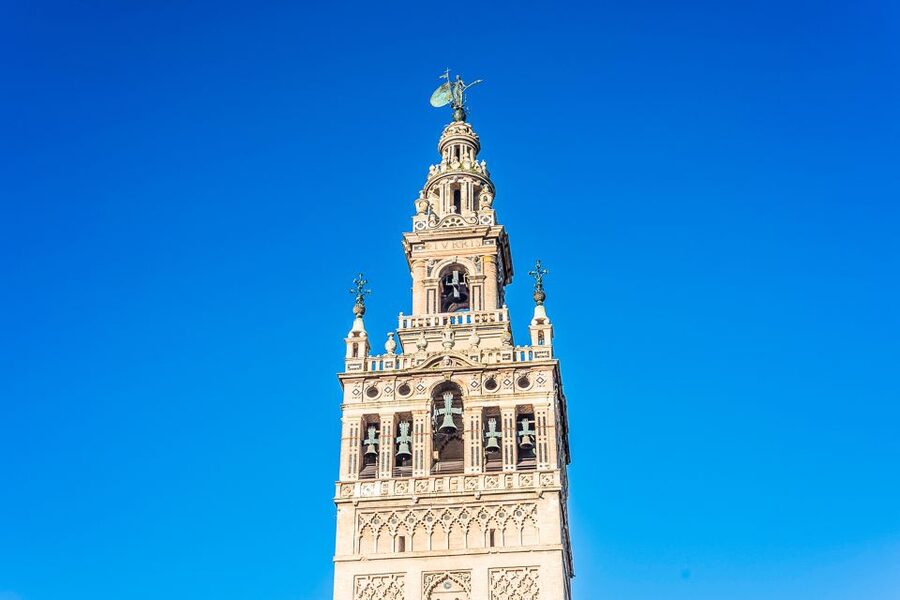 Seville: Cathedral and La Giralda Entry Ticket - Entering Seville Cathedral through the side entrance