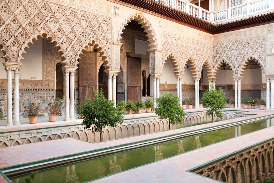 Seville: Cathedral, Giralda & Alcazar Entry With Guided Tour - The Alcazar: palace rooms, orange trees, and myrtles