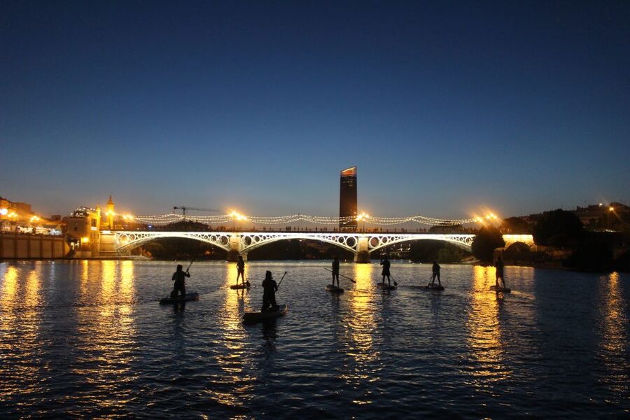 Seville: Sunset and Evening Paddle Boarding Tour - Torre del Oro after dark