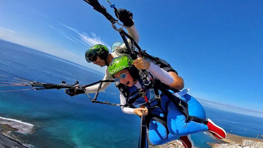 Tenerife: Tandem Paragliding Flight - Getting ready with a harness, helmet, and briefing