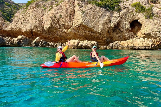 Uncharted Marine Reserve Cave, Snorkel & Cliff Jumping Kayak Tour - Getting back into the kayak is the awkward bit