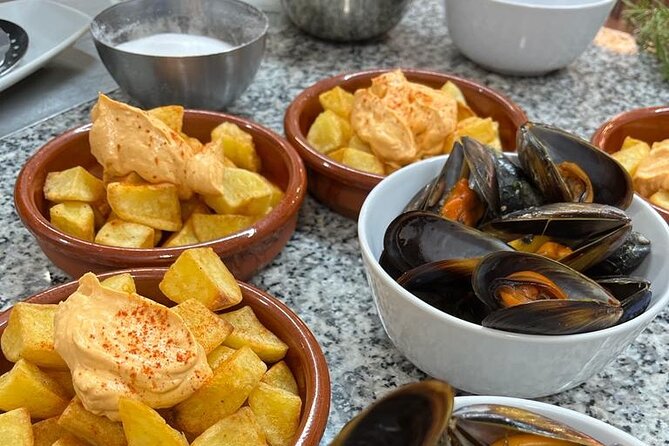 Valencian paella cooking class, tapas and visit to Ruzafa market. - Booking, cancellation, and timing advice